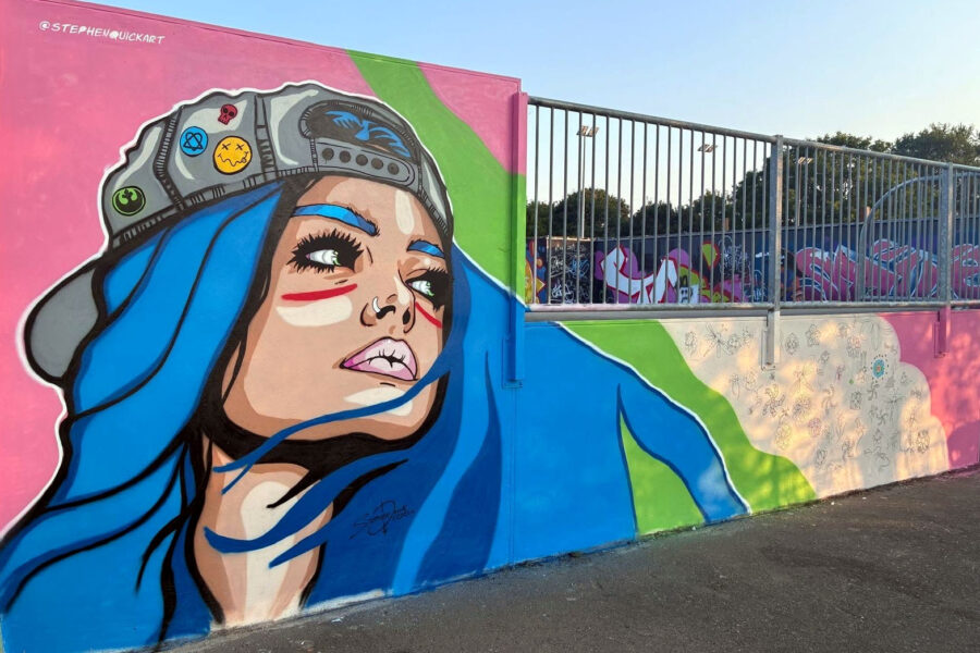 Honiton Skate Park mural of skater girl with long blue hair by artist Stephen Quick